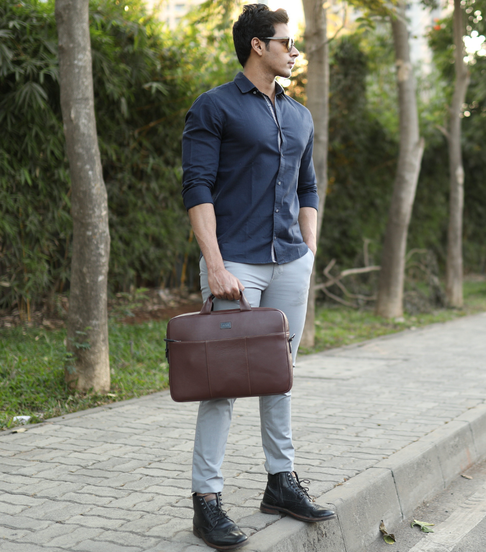 Man holding a brown leather briefcase with text about personalized gifts for Father's Day.